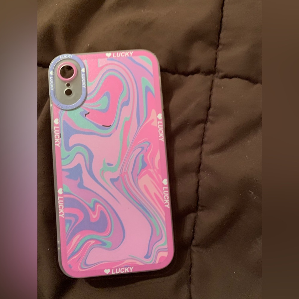 I’m selling an iPhone XR phone case is pick with blue and purple very new.